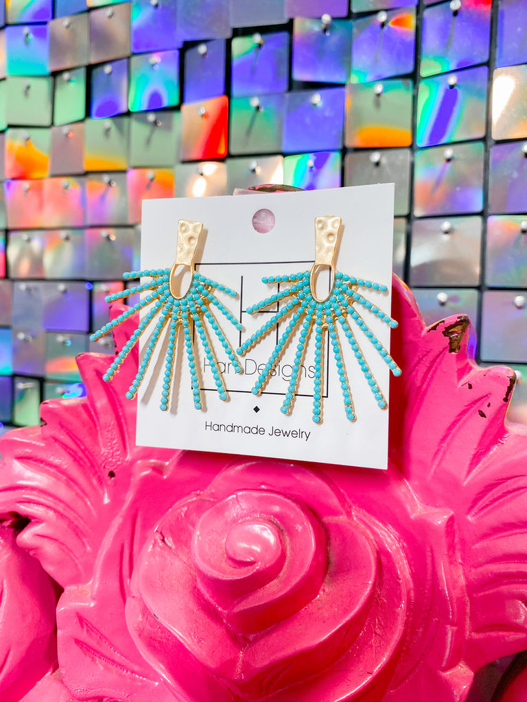 Shop women's accessories including these turquoise and gold earrings. 