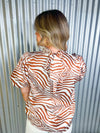 Cream and brown zebra print short sleeve top.