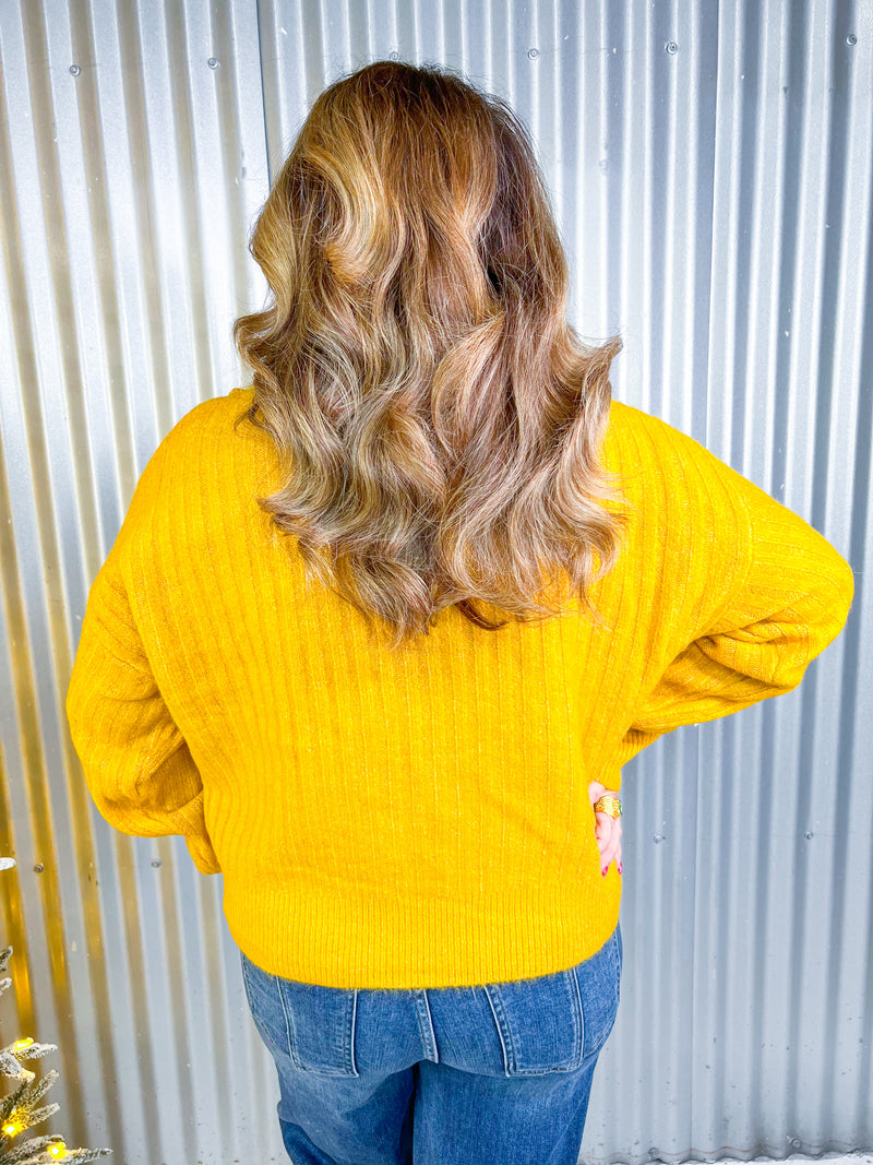 Mustard color quarter zip sweater. 