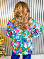 Pink, blue, and orange floral print long sleeve blouse.