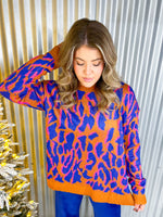 Orange and blue leopard print sweater.