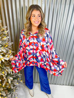 Red, pink, blue, and white floral oversized button down top. 