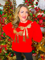 Red Christmas sweater with front gold bow-shaped sequins.