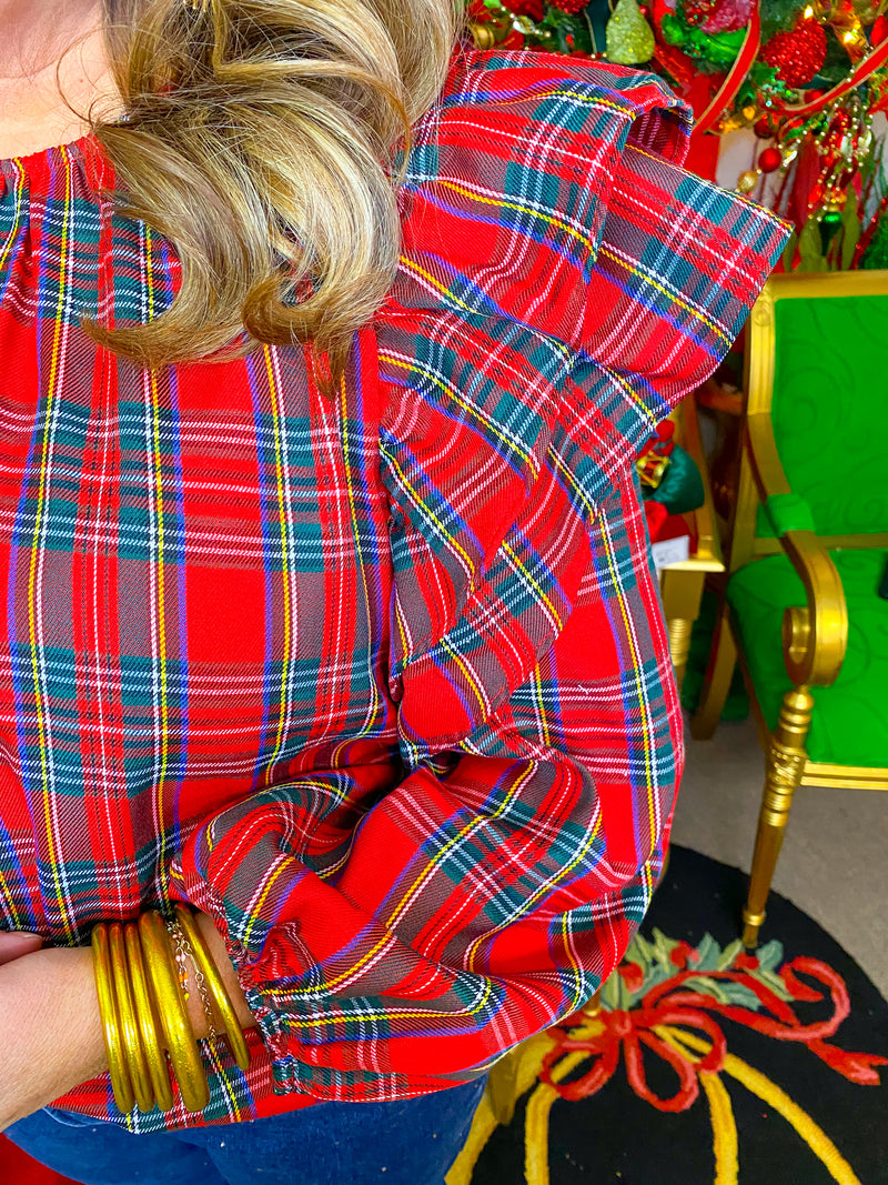Red Christmas plaid long sleeve top with double ruffle shoulder details.