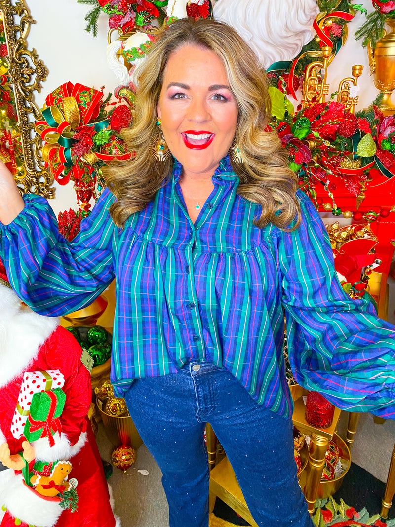 Blue and green plaid button-down blouse with red accent.