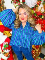 Blue and green plaid button-down blouse with red accent.
