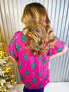 Fuchsia with green print v-neck short sleeve top. 