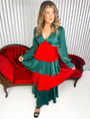 Green and red ruffle tiered dress with empire waist and bubble sleeves. 