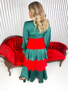 Green and red ruffle tiered dress with empire waist and bubble sleeves. 